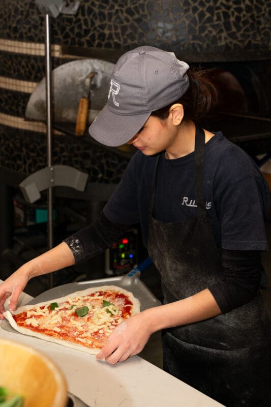 pizzaioli making neapolitan pizza
