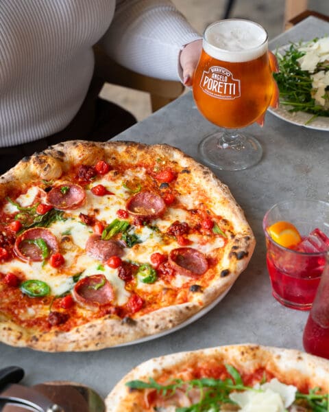 cheese and pepperoni authentic neapolitan pizza with drinks